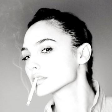 Gal Gadot poses while smoking