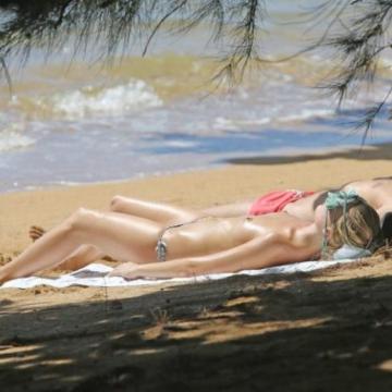 Margot Robbie goes topless in public