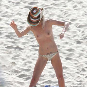 Laeticia Hallyday showing off sexy body and goes topless