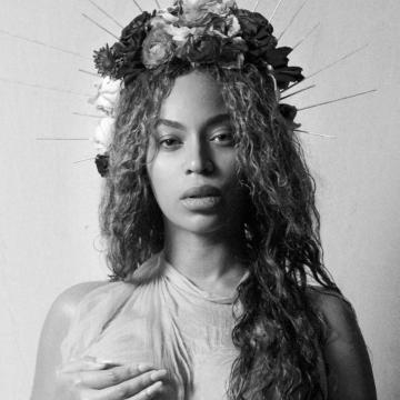 Beyonce Knowles covers bare boobs