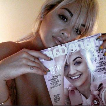 Rita Ora topless while reading