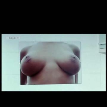 Nina Proll shows bare big huge tits